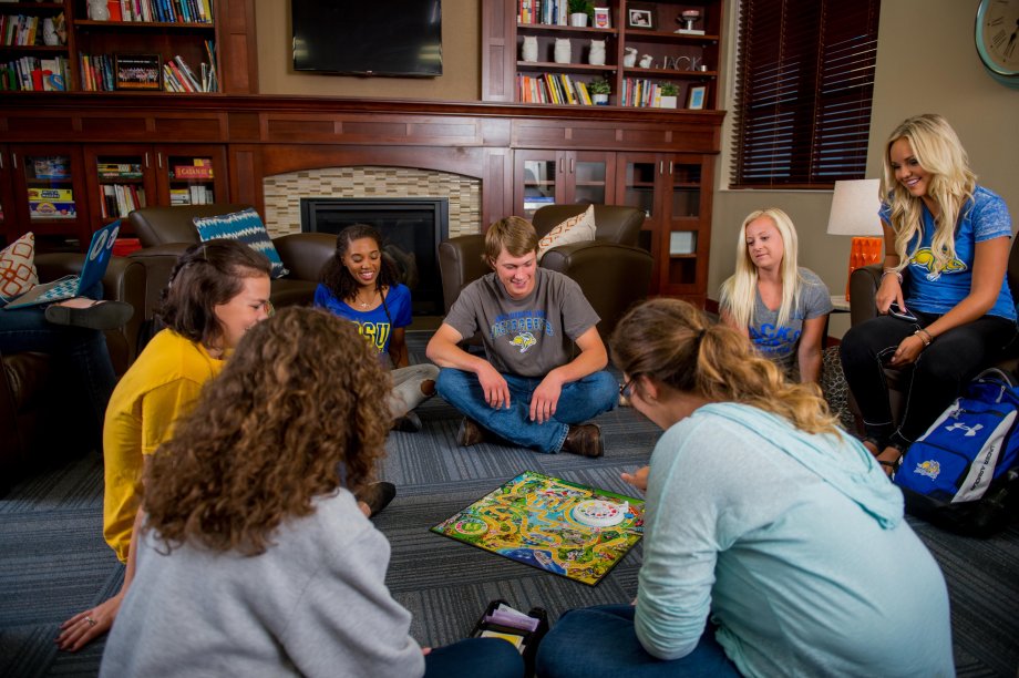 Students playing a board game