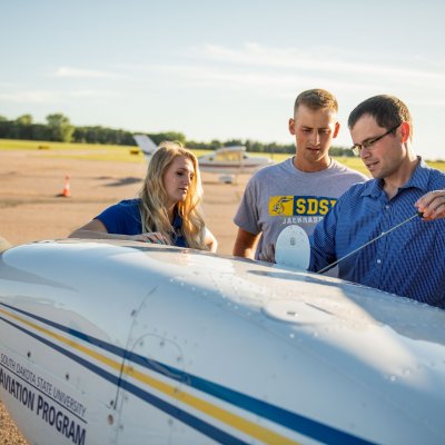 Aviation Students with a Plane