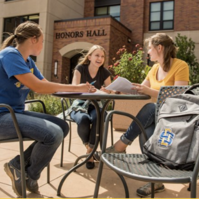 Students studying outside Honors Hall