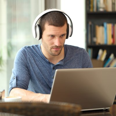 Male Studying with headphones on