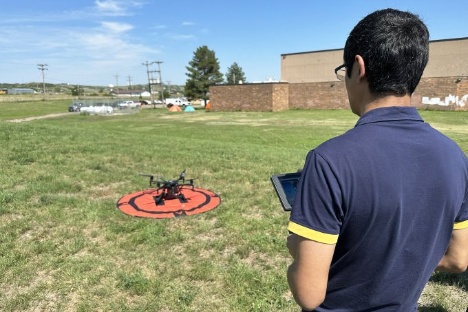 A participant flies a drone in the Lakota Uncrewed Aircraft Systems Program.